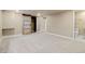 Finished basement bedroom with sliding closet door and neutral carpet and paint at 10273 Nottingham Dr, Parker, CO 80134