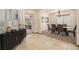 Inviting entryway with tile flooring, stylish console table, and seamless flow into the dining and living areas at 10273 Nottingham Dr, Parker, CO 80134