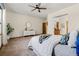 Spacious main bedroom with a ceiling fan, and en-suite bath with a vanity and mirror at 10273 Nottingham Dr, Parker, CO 80134