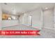 Bright, open-concept living room features plush carpeting and easy access to the modern kitchen at 1401 W 85Th Ave # F201, Federal Heights, CO 80260