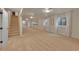 A spacious basement features neutral carpet, white walls, and bright lighting at 1321 Ruby Way, Longmont, CO 80504