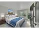 Comfortable bedroom with ample lighting and closet space, perfect for relaxation at 1321 Ruby Way, Longmont, CO 80504