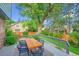 Inviting outdoor deck with a dining table and chairs, perfect for enjoying the serene backyard view at 1321 Ruby Way, Longmont, CO 80504