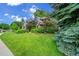 Beautiful home with mature landscaping and a well-manicured front yard at 1321 Ruby Way, Longmont, CO 80504