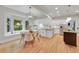 Bright and airy kitchen with white cabinets, stainless steel appliances, and a center island at 1321 Ruby Way, Longmont, CO 80504