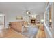 Cozy living room featuring a brick fireplace, built-in shelves, and a comfortable sectional sofa at 1321 Ruby Way, Longmont, CO 80504