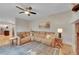 Comfortable living room featuring a fireplace, sectional sofa, and hardwood floors at 1321 Ruby Way, Longmont, CO 80504