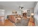 Warm and inviting living room with a fireplace, hardwood floors, and stylish decor at 1321 Ruby Way, Longmont, CO 80504
