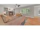 Comfortable living room with a cozy fireplace, built-in shelving, and hardwood floors at 1321 Ruby Way, Longmont, CO 80504