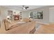 Inviting living room features a brick fireplace, built-in shelves, and a large window overlooking the outdoor deck at 1321 Ruby Way, Longmont, CO 80504
