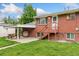 Backyard with a covered patio and direct access to the main house at 6721 Quay Ct, Arvada, CO 80003