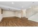Large finished basement featuring wood-look flooring, recessed lighting, and stairs leading to the upper level at 6721 Quay Ct, Arvada, CO 80003