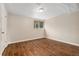 Finished basement room with wood-look flooring, a window, and a neutral color scheme for a cozy atmosphere at 6721 Quay Ct, Arvada, CO 80003