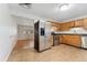 Well-equipped kitchen with stainless steel appliances and bright adjacent dining area at 6721 Quay Ct, Arvada, CO 80003