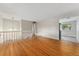Open-concept living room with hardwood flooring and views to other living spaces at 6721 Quay Ct, Arvada, CO 80003