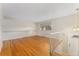 Bright living room featuring hardwood floors and stairway access to upper level at 6721 Quay Ct, Arvada, CO 80003