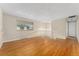 Bright living room featuring hardwood floors, natural light and stairway access at 6721 Quay Ct, Arvada, CO 80003