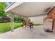 Spacious covered patio with a red picnic table in the backyard at 6721 Quay Ct, Arvada, CO 80003