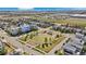 A beautiful aerial view of the neighborhood showcasing the lush green spaces, modern homes, and convenient community park at 9446 E 51St Dr, Denver, CO 80238