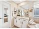 Bright bathroom with granite countertops, double sinks, and a walk-in shower at 9446 E 51St Dr, Denver, CO 80238