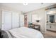 Neutral bedroom with ample closet space and en-suite bathroom access at 9446 E 51St Dr, Denver, CO 80238