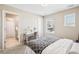Bedroom with great natural light and en-suite bath at 9446 E 51St Dr, Denver, CO 80238