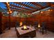 Cozy backyard fire pit area with comfortable seating, perfect for entertaining and relaxing outdoors with ambient lighting at 9446 E 51St Dr, Denver, CO 80238