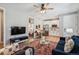 Open-concept living room with a dining area and kitchen, perfect for entertaining at 9446 E 51St Dr, Denver, CO 80238
