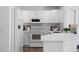 Beautiful white kitchen with modern appliances and ample cabinet space at 14247 Pikeminnow Pl, Broomfield, CO 80023