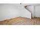 Cozy living space with modern lighting, wood floors, and a staircase at 14247 Pikeminnow Pl, Broomfield, CO 80023