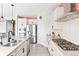 Bright, modern kitchen with stainless steel appliances, gas cooktop, and an island with a sink at 4280 Pioneer Pl, Brighton, CO 80601