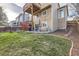 Backyard features lush lawn, deck, patio, and fence at 9624 Crosspointe Dr, Highlands Ranch, CO 80130