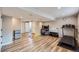 Spacious finished basement featuring wood floors, a mini fridge, and rec space at 9624 Crosspointe Dr, Highlands Ranch, CO 80130