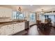 Bright kitchen that transitions to dining area features stainless steel appliances and granite counters at 9624 Crosspointe Dr, Highlands Ranch, CO 80130