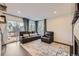 Comfortable living room with a sliding door that provides access to the balcony at 9624 Crosspointe Dr, Highlands Ranch, CO 80130