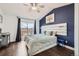 Comfortable main bedroom with a vaulted ceiling, private balcony and en-suite bathroom at 9624 Crosspointe Dr, Highlands Ranch, CO 80130