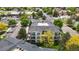 Well-maintained apartment building with charming balconies, lush greenery, and convenient parking at 1670 S Deframe St # C2, Lakewood, CO 80228