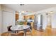 Eat-in kitchen featuring stainless steel appliances, wooden cabinetry, and hardwood flooring at 1670 S Deframe St # C2, Lakewood, CO 80228