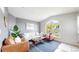 Bright living room with a large window, stylish decor, and comfortable seating arrangement at 1670 S Deframe St # C2, Lakewood, CO 80228
