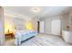 Cozy bedroom featuring a bed, nightstands, and barn doors offering style and functionality at 11829 Deorio St, Parker, CO 80134