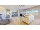 Bright living room featuring a fireplace, neutral color palette, and ample natural light at 11829 Deorio St, Parker, CO 80134