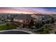 Aerial view of house at sunset with mountain views at 15994 La Plata Peak Pl, Broomfield, CO 80023