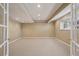 Bright finished basement featuring neutral walls, carpet, recessed lights, and a window at 5134 S Fraser Way, Aurora, CO 80015