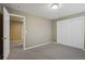 Spare bedroom with carpeted floors and closets, offering plenty of storage at 5134 S Fraser Way, Aurora, CO 80015