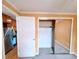 Bedroom with mirrored closet and open doorway to the kitchen at 1135 N Elizabeth St # 102, Denver, CO 80206