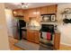 The kitchen features stainless steel appliances and granite countertops at 1135 N Elizabeth St # 102, Denver, CO 80206