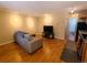 A comfortable living room flows into a modern kitchen with stainless appliances at 1135 N Elizabeth St # 102, Denver, CO 80206