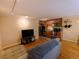 A sunlit living room flows into a modern kitchen with sleek appliances and hardwood floors at 1135 N Elizabeth St # 102, Denver, CO 80206