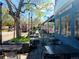Restaurant with sidewalk cafe seating area and tree lined street at 1135 N Elizabeth St # 102, Denver, CO 80206