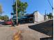 Commercial building with cafe and fenced outdoor seating area at 1135 N Elizabeth St # 102, Denver, CO 80206